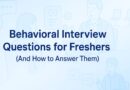 Banner image with the title 'Behavioral Interview Questions for Freshers (And How to Answer Them)' on a light blue gradient background, featuring line-style illustrations of an interview conversation, HR chat bubbles, checklist icons, and office chairs.