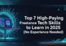 Freelancer working remotely on a laptop, learning tech skills in 2025 with no prior experience.